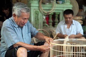 Artisans making bird cages