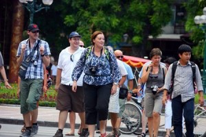 Foreigners crossing the road in Hanoi