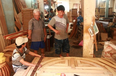 An artisan teaching his students, Bich Chu Carpentry Village