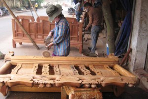 Craftmen sculpturing wooden products