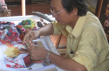 Skillful hands of artisan on embroidery products