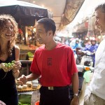 Tourists with guide in local market with Highway 4 Cooking Class