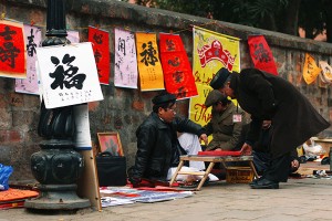 Calligrapher outside of Temple of Literature, Hanoi in Tet Holiday