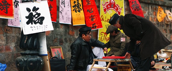 Calligrapher outside of Temple of Literature, Hanoi in Tet Holiday
