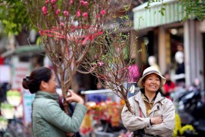 Hanoi people in festive atmosphere of Tet Holiday