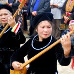 Tay women playing traditional intrument
