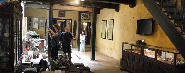 Tourist walk around and take photo of 87 Ancient House