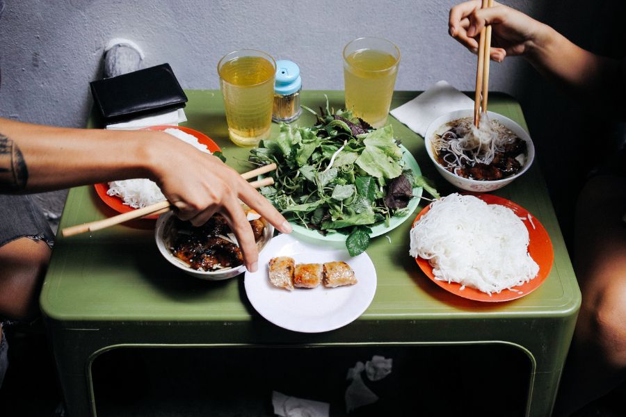 Bun cha served with grilled pork, rice noodles and fresh herbs