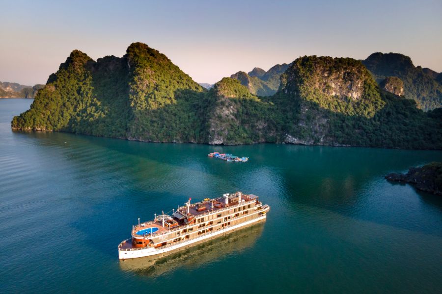 Overnight cruise sailing among limestone islands in Halong Bay