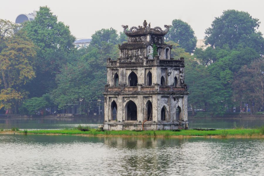 Turtle Tower and tree-lined shores of Hoan Kiem Lake in Hanoi